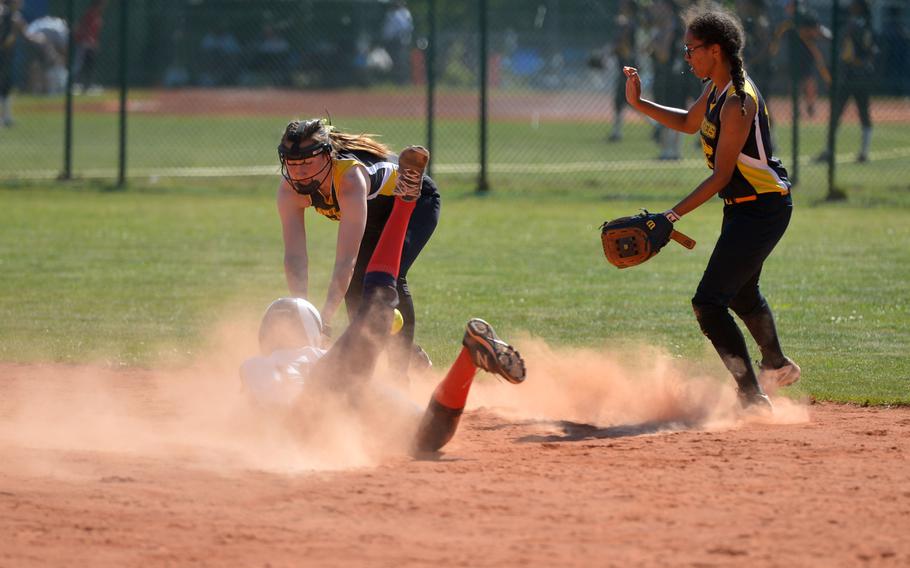 Stuttgart's Carly Sharp attempts to tag out Lakenheath's Emily Conde as teammate Amber Grable backs her up in a Division I game at the DODEA-Europe softball tournament in Ramstein, Germany, Thursday, May 25, 2017. Stuttgart won 7-6.