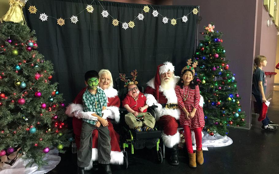 Nathan Tarwater, now 17, visits Santa and Mrs. Claus in December 2016 with his sister Addison, left, his brother Caden, left and his sister Addison, right at Morgan's Wonderland theme park in San Antonio. Nathan, who was born with a rare choromosome disorder that renders him medically fragile, has defied doctors predictions that he would not survive to his first birthday.