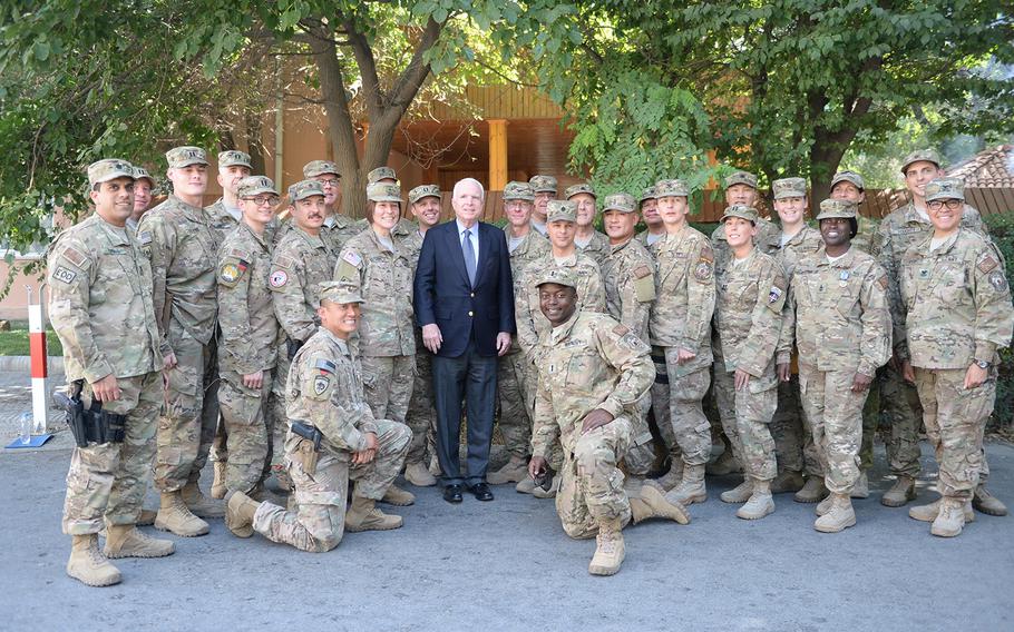 Sen. John McCain, R-Ariz., poses with U.S. servicemembers at NATO's Resolute Support Headquarters in Kabul on Tuesday, July 4, 2017.