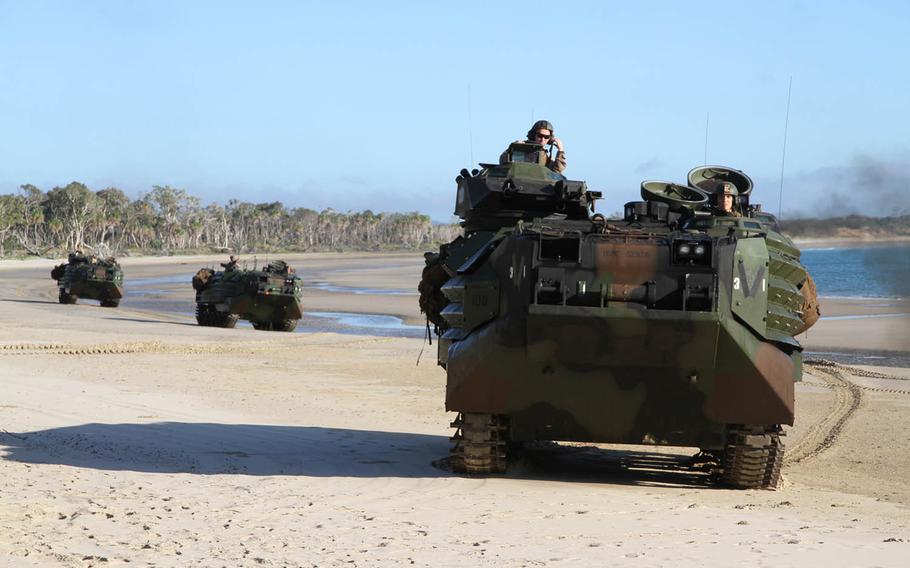 Marine Corps amphibious assault vehicles made their landings and immediately pushed inland to engage mock opposition forces during Talisman Saber drills at Shoalwater Bay Training Area, Australia, Wednesday, July 19, 2017.