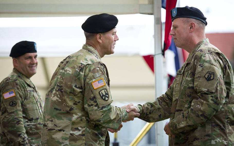 Brig. Gen. Frederick R. Maiocco Jr., right, incoming 7th Mission Support Command commander, shakes hands with Brig. Gen. Steven Ainsworth during the MSC's change-of-command ceremony at Daenner Kaserne, Germany, on Friday, Aug. 4, 2017. Ainsworth is the outgoing MSC commander.