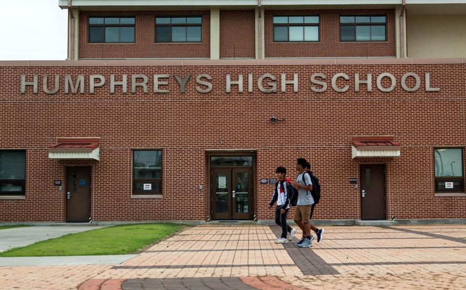 Students walk home after their first day of classes at Camp Humphreys High School, South Korea, Monday, Aug. 28, 2017.