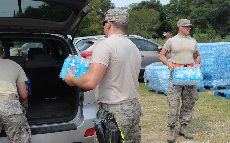 Members of the 136th Airlift Wing of the Texas National Guard provide emergency ration meals to residents of China, Texas, on Sept. 3, 2017.