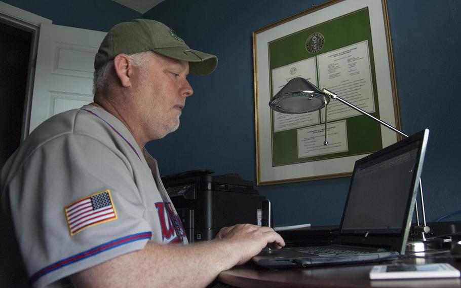 In his home office on Aug. 16, 2017, Operation Desert Storm veteran Ronald Brown works on an Illinois veteran's claim for VA benefits. Brown and two other veterans with the National Gulf War Resource Center help veterans all over the country get connected to VA benefits.