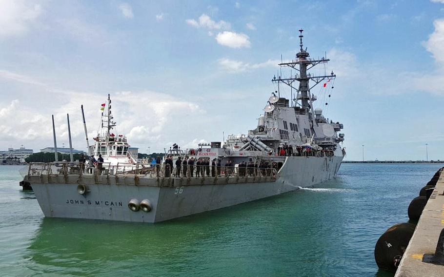 The USS John S. McCain arrives at Changi Naval Base, Singapore, following a collision with the merchant vessel Alnic MC while underway east of the Straits of Malacca and Singapore on Aug. 21, 2017.