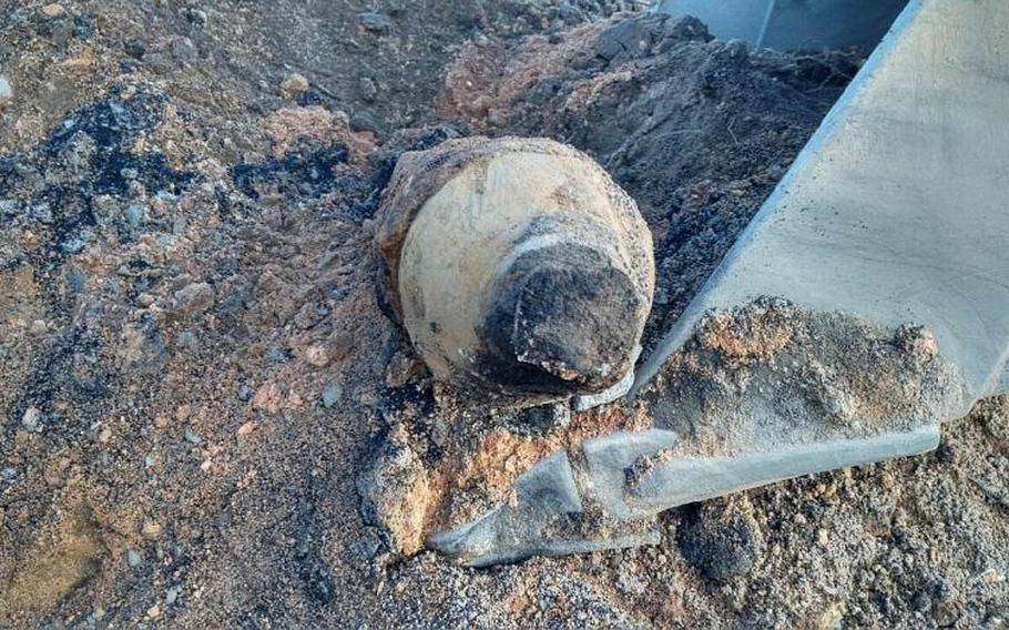 A WWII-era, unexploded bomb is revealed at a construction site for a new school near the U.S. Army's Grafenwoehr Training Area on Wednesday. German authorities defused the bomb and U.S. soldiers later detonated the 1,000-pound bomb.