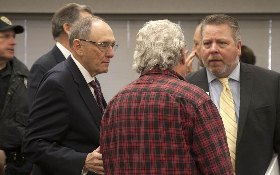 Veteran William Matthews, center, speaks with Rep. Phil Roe, R-Tenn. and Tom McNabb, military liaison for Rep. French Hill, R-Ark. before a town hall meeting Monday, Nov. 20, 2017 at the John L. McClellan Memorial Veterans Hospital in Little Rock, Ark.
