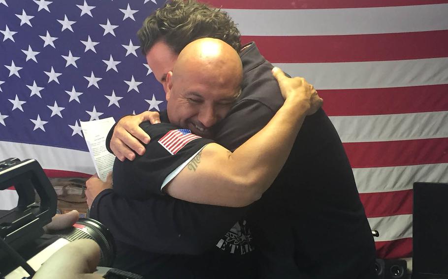 Deported Army veteran, Hector Barajas-Varela, hugs former state Assemblyman and Marine Nathan Fletcher on April 15 at the shelter for deported veterans  in Tijuana, Mexico, after learning that he'd been pardoned by the California governor.