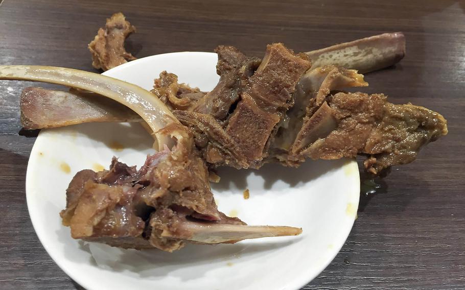 Lamb bones stewed with soy sauce is one of many affordable and tasty dishes from Tohoku Jinka in the Chinatown section of Yokohama, Japan.