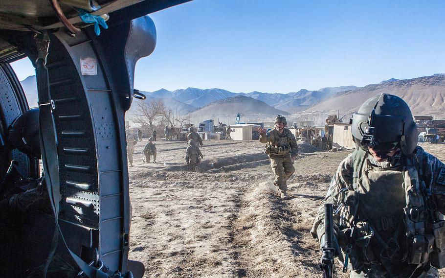 A medevac helicopter carrying a crew from the  Tenth Mountain Division's, C-Company, 3-10 General Support Aviation Battalion lands at the site of a wounded soldier in eastern Afgahnistan in 2011. Six men from the unit were followed home from the mission in the documentary "Trauma."