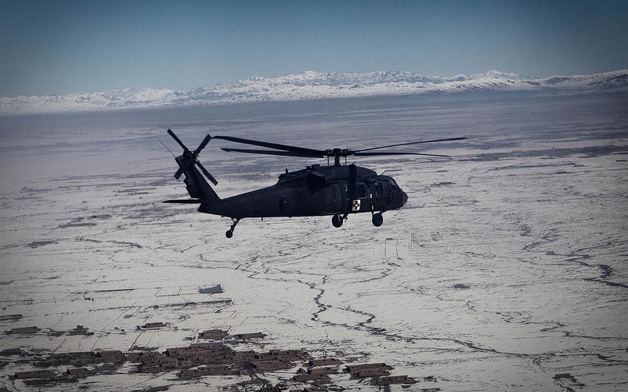 A medevac helicopter flies over eastern Afgahnistan in 2011 en route to picking up wounded soldiers. The documentary film Trauma follows six men from the 10th Mountain Division’s Company C, 3rd General Support Aviation Battalion, 10th Aviation Regiment home from their medevac mission in Afghanistan in 2011.