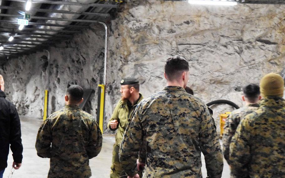 Marines are shown the inside of one of the Marine Corps Pre-Positioning Norway caves in the Trondelag region of northern Norway, Friday, Feb. 2, 2018.