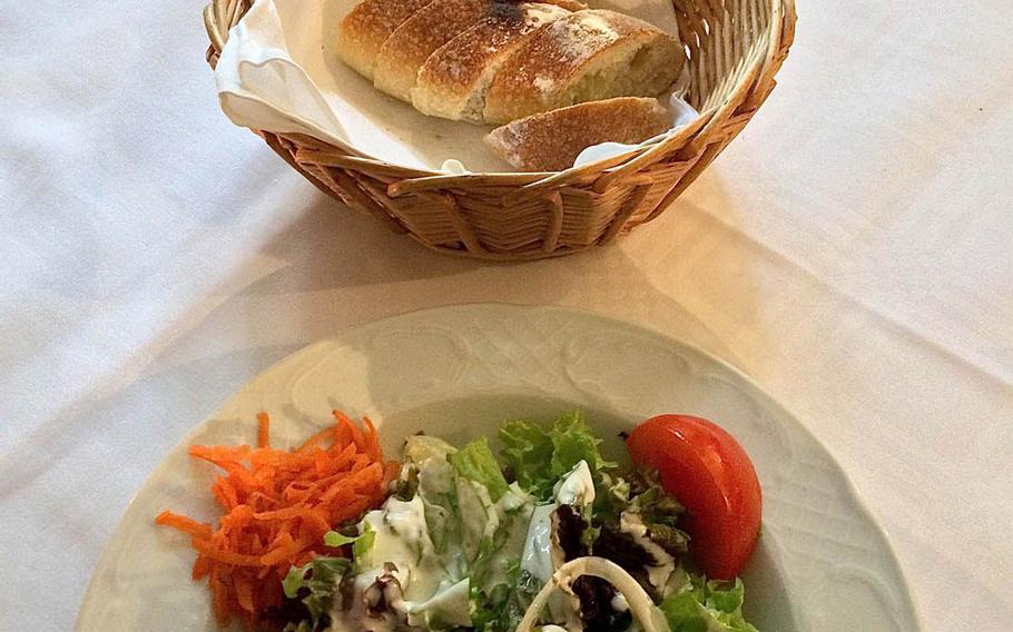 A green salad with fresh bread as served at Rossini in Kaiserslautern, Germany. Rosinni's menu covers a host of traditional Italian favorites with a few surprises.