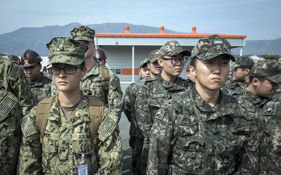 U.S. and South Korean sailors listen to a safety briefing during a Foal Eagle exercise in Jinhae, South Korea, March 13, 2017.