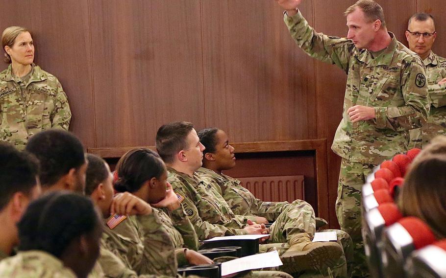 Lt. Col. Troy Morton, commander of the Baumholder Health Clinic, explains Legionnaires' disease to troops on Wednesday, March 7, 2018. The soldiers live in barracks that tested positive for Legionella bacteria, which causes the disease.

Will Morris/Stars and Stripes
