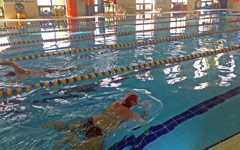 Patrons swim laps at the fitness center pool on April 27, 2018, at Navy Base Capodichino in Naples, Italy. Morale, Welfare and Recreation's decision to reinstate 2014 user fees at Mediterranean pools has upset many military residents. The lap pool pictured here is one that will remain free for U.S. ID holders and fitness center members.