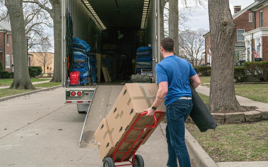A contractor loads a moving truck with household goods during the permanent change of station move at Scott Air Force Base, Ill., March 7, 2018. 