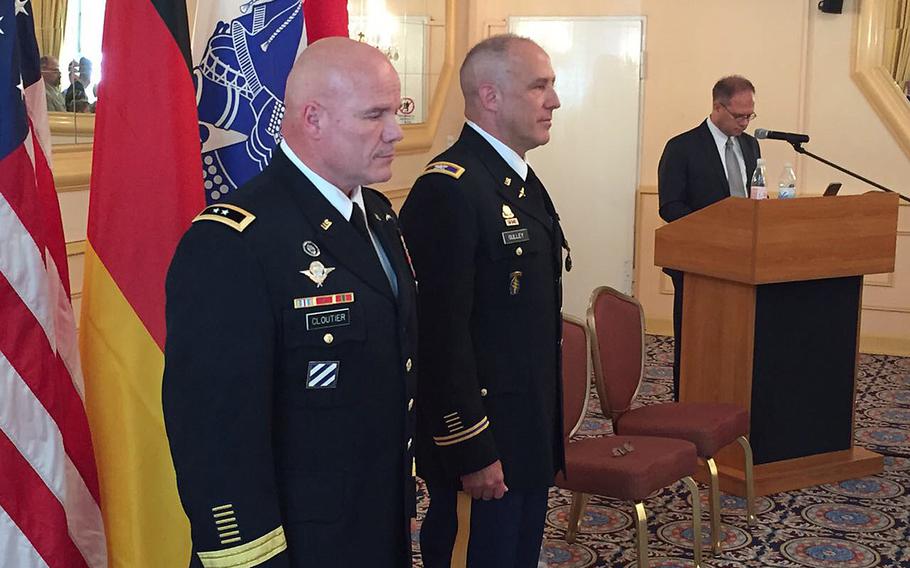 Maj. Gen. Roger Cloutier, U.S. Africa Command's chief of staff, left, stands with Col. Richard Gulley during Gulley's retirement ceremony June 30, 2017, in Stuttgart, Germany. Gulley, along with numerous other reservists, says he was unfairly targeted by Army investigators over housing benefits.