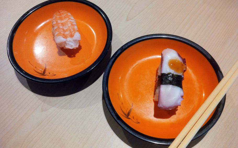 Not all sushi is raw. Two classic options, cooked shrimp and cooked octopus, on offer at Aki Running Sushi, an all-you-can-eat sushi restaurant at K in Lautern in Kaiserslautern, Germany.