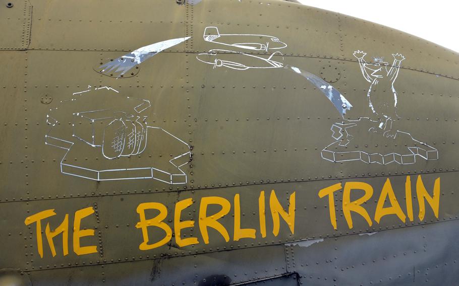 A bear, the symbol of Berlin, happily awaits the arrival of an airplane from West Germany, as depicted on the nose art of the Berlin Train, a Douglas C-47 that is part of the Berlin Airlift Memorial at Frankfurt Airport.