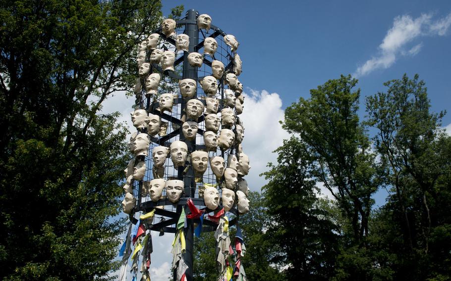 The "Wishing Tree-Faces of Hope" exhibit is at the base of the Schaumberg tower in Tholey, Germany.