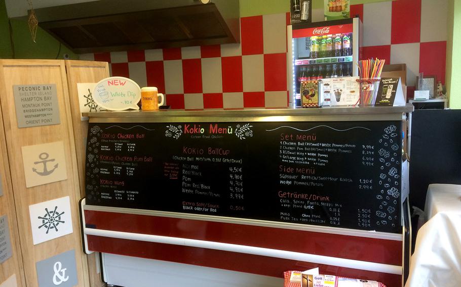 The interior and menu board at Chicken Kokio in Wiesbaden, Germany. The recently opened restaurant features mainly Korean fried chicken along with some side dishes.