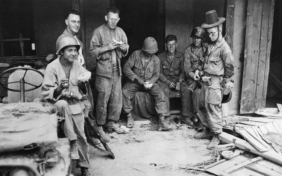Soldiers with the 25th Infantry Division take a break near the front lines in South Korea, Aug. 19, 1950.