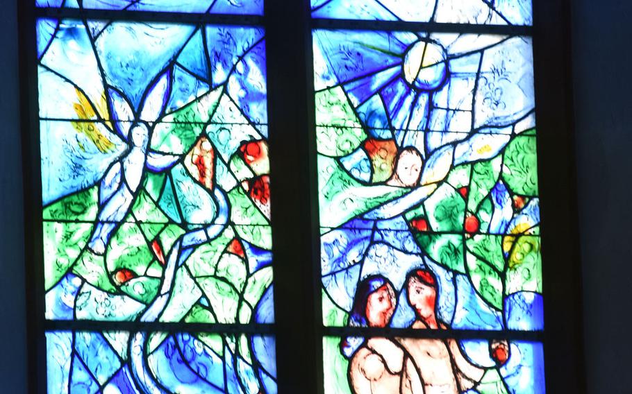 Adam and Eve stand next to an apple tree in a Marc Chagall window at St. Stephan's church in Mainz, Germany.