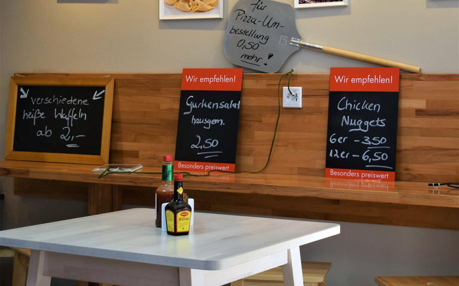 Italian Style Pizza & Pasta in Kaiserslautern, Germany, makes visitors comfortable with a clean, attractive dining room featuring free phone-charging stations.