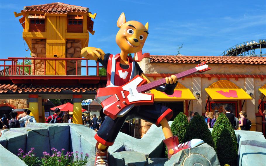 Walibi Belgium's guitar-playing mascot, who shares the name Walibi, welcomes visitors to the park with a statue just inside the front gate.