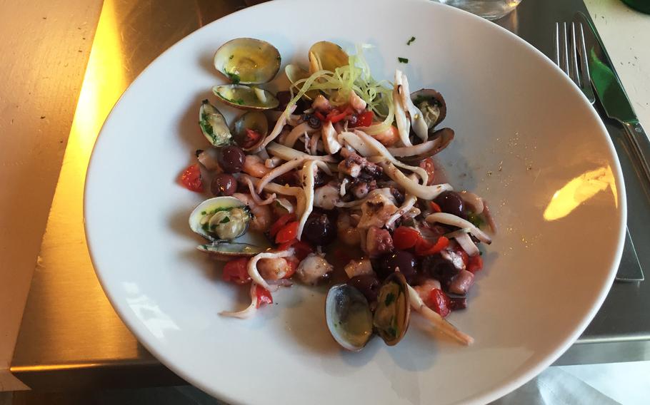 Insalata di Mare (seafood salad) with mussels, shrimp and octopus. Grangusto offers fine seafood along with meat dishes, pizza and and huge wine selection in a setting with a South Miami Beach flavor.