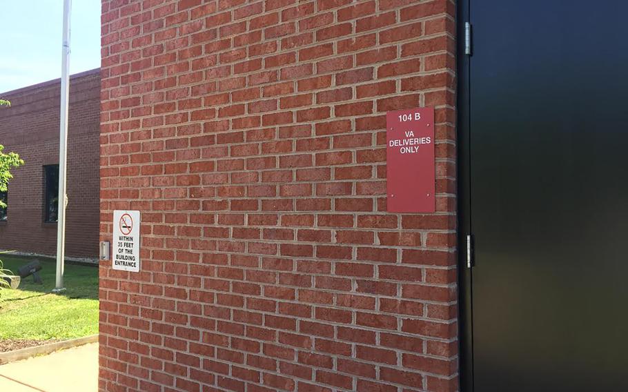 A sign marks the doors for VA deliveries at a building in Shepherdstown, West Virginia, that is now home to the White House VA Hotline. President Donald Trump promised during his 2016 campaign to establish a White House hotline, which he portrayed as a direct line to the executive branch. 