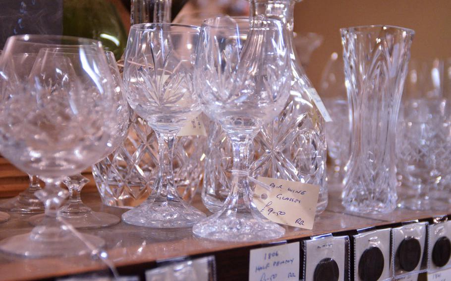 Wine glasses and rare coins for sale at the Risby Barn Antique Centre in the village of Risby. 