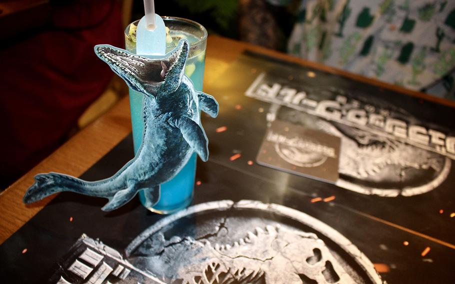 The Mosasaurus soda at the Jurassic World pop up inside Tokyo's The Guest Cafe is a yogurt-flavored fizzy drink with blue dye to emulate a lagoon. 