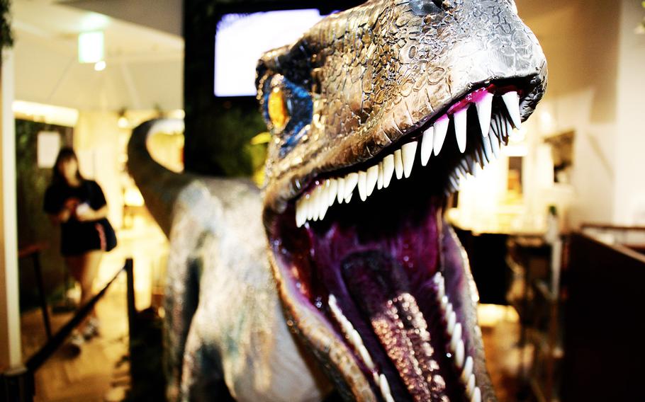 An Indominus rex from Jurassic World greets diners at The Guest Cafe's popup in central Tokyo.