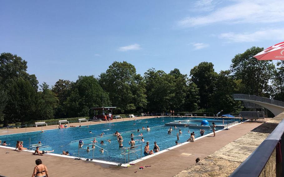 At the adult pool at Hoehenfreibad in Stuttgart, Germany, there are swimming lanes, high dives and an easygoing collection of bathers.