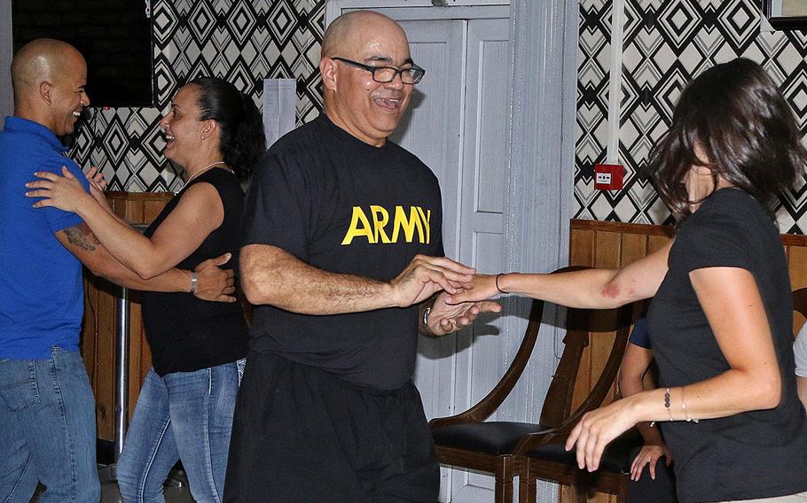 Soldiers of the Puerto Rico Army National Guard's 191st Regional Support Group Forward dance during salsa night in Kabul. Members of the Puerto Rico-based unit deployed to Afghanistan after helping those who lost everything in Hurricane Maria last fall.