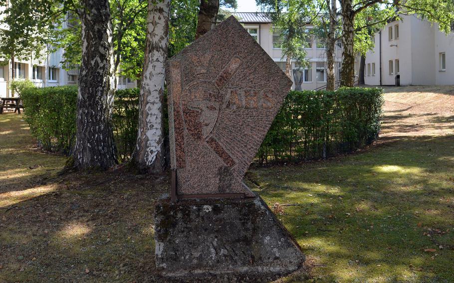 This stone with KAHS for Kaiserslautern American High School has stood in this shaded area popular with students, since at least the 1970s. It will eventually be moved to the new high school opening at the start of the school year.
