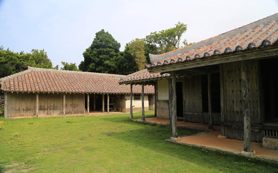 In Izena Island's Nakada Village, traditional Okinawan houses are preserved for visitors.
