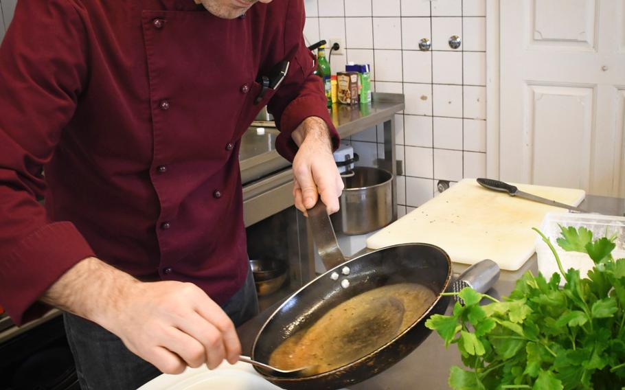 Skendo Shala, the chef at Ristorante Cardinale in Kaiserslautern, Germany, prepares his favorite dish, saltimbocca alla Romana, during lunch. The dish is made of veal lined with prosciutto and reflects the Croatian-born Shala?s education in Italian cuisine.