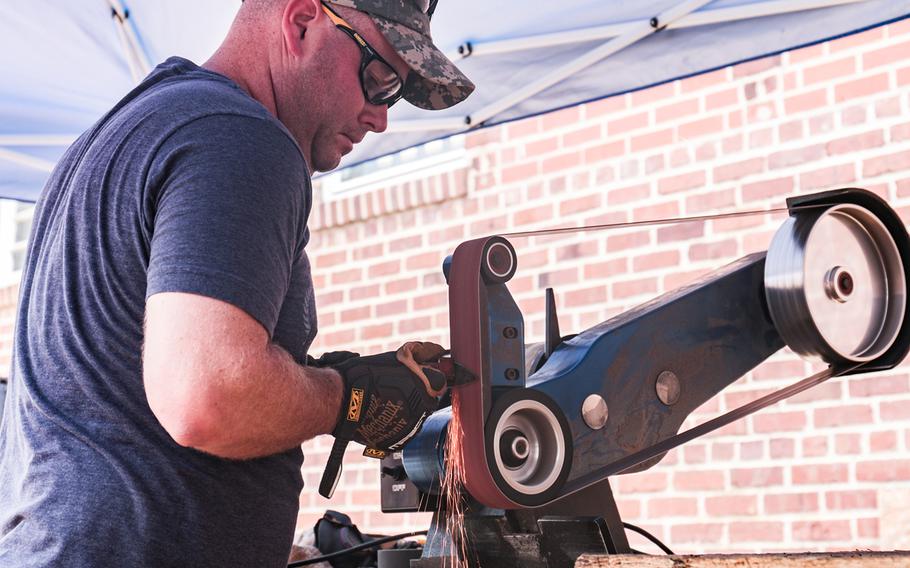Sgt. 1st Class Keith Shugarts works on a knife he's forging at the Workhouse Arts Center in Lorton, Va. The Center is home to Recovery Forge, a veteran-run program that teaches forging skills to servicemembers, veterans and first responders.