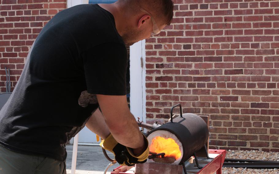 Sgt. Eric Lang, an Army reservist, works on forging a blade at the Workhouse Arts Center in Lorton, Va., on Aug. 11, 2018. 