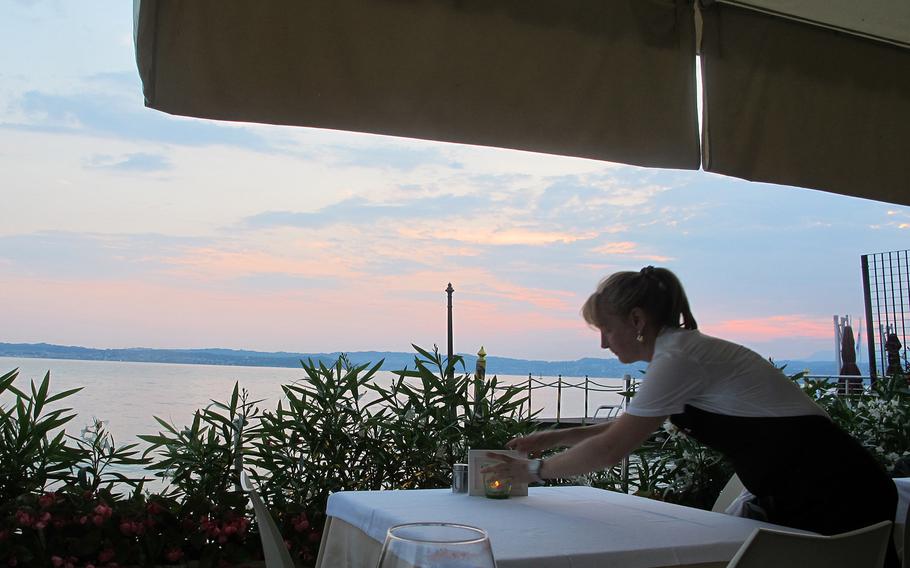 The restaurant Arcimboldo in Sirmione, Italy, has seating on a terrace on the shore of Lake Garda, where diners can watch ferry boats glide by in the sunset. Service is friendly and efficient.
