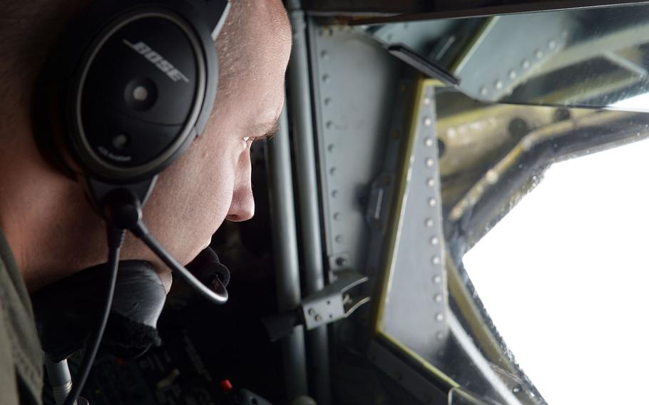 Tech Sgt. Justin Miller, a boom operator on a RAF Mildenhall-based KC-135 Stratotanker of the 100th Air Refueling Wing, waits for a F-22 Raptor to show up for an aerial refueling over Norway, Wednesday, Aug. 15, 2018.