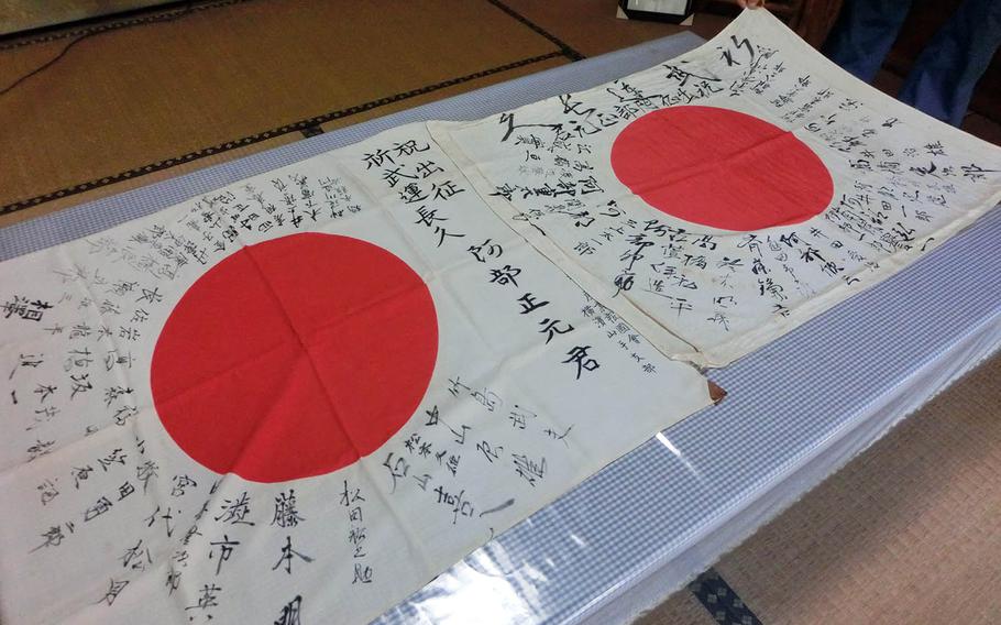 Two signed Japanese flags belonging to fallen World War II soldier Masamoto Abe have been returned to the his family in Yokohama, Japan.