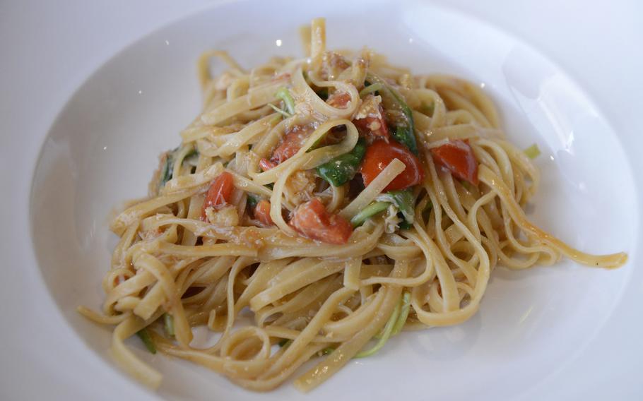 This dish of tagliolini, served at Oniga in Venice, Italy, features crab, tomatoes and baby spinach.