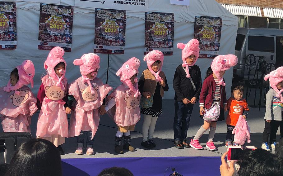 Children participate in the "Piglet Parade" on Nov. 3, 2017, during the Japan Bacon Festival in Kofu, Japan.