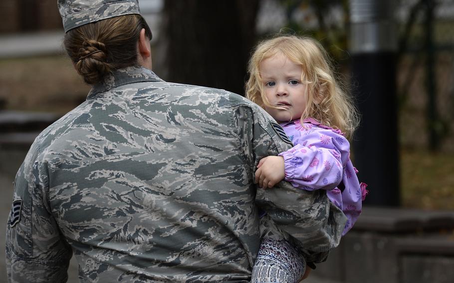 Staff Sgt. Symantha Schearer walks out of the Ramstein Child Development Center with her 3-year-old daughter, Aura, Thursday, September 13, 2018. Schearer said she was on the list for about a year before she got a spot at the CDC.