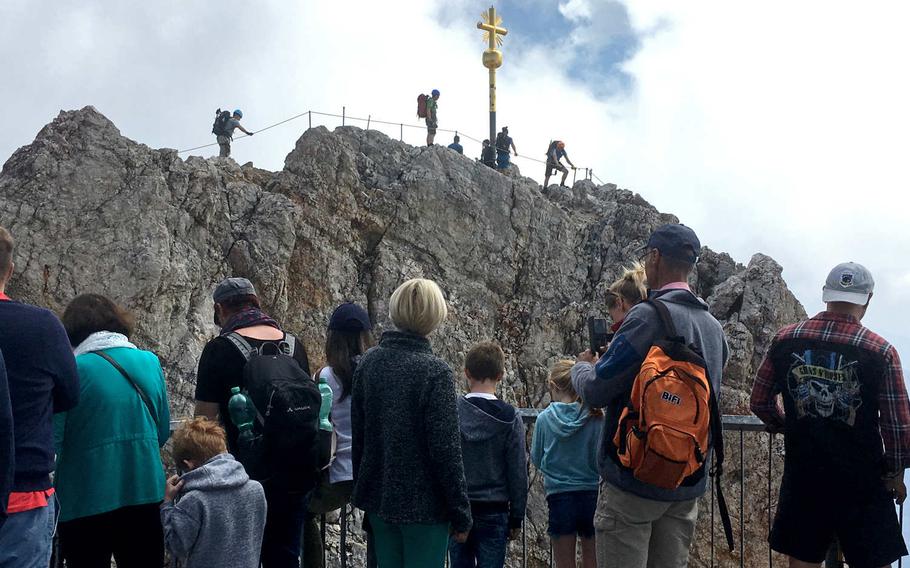 Visitors to the Zugspitze, Germany’s tallest mountain near Garmisch-Partenkirchen, can climb to the very peak of the mountain, but it is a little risky.