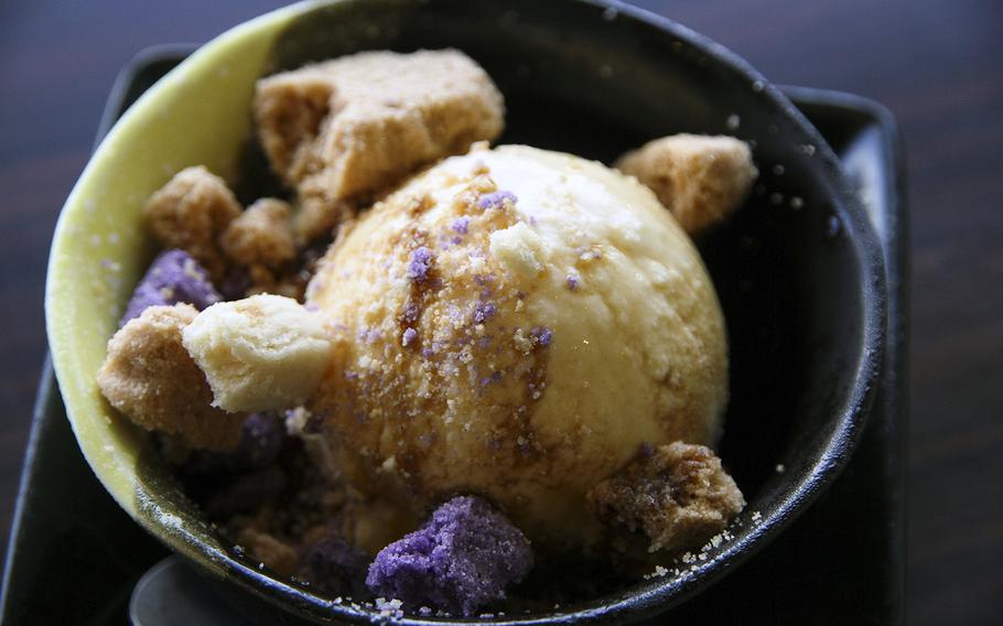 Hanakinah Okinawa Soba's vanilla ice cream topped with Okinawa salt cookies and sugar cane syrup.